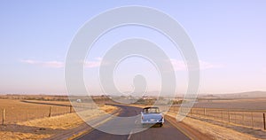 Drone, car driving and travel on road trip, adventure and summer outdoor on sky mockup space. Rear view, friends and