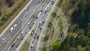 DRONE: Cars driving along congested entry lane and joining the highway traffic.