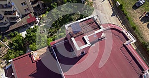 Drone Circling view of the red roof with solar panels