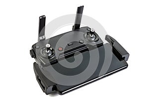 Drone controler with mobile phone connected isolated above white background