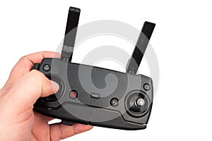 Drone controller with antennas in the hand above white background