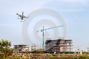 Drone copter flying with digital camera.Drone with high resolution digital camera over construction site. video industrial inspect