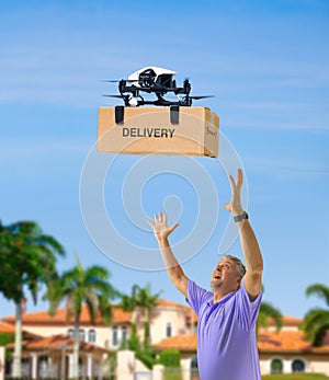 Drone delivering box package on delivery flight to a happy waiting man with outstretched arms