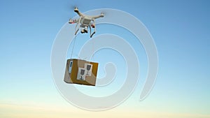 Drone delivering package on the sky background