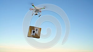 Drone delivering package on the sky background. Slow motion
