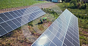 Drone, engineering or people with solar panels in nature for renewable energy, clean electricity or sustainability