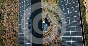 Drone, engineering or people with solar panels in nature for renewable energy, clean electricity or sustainability