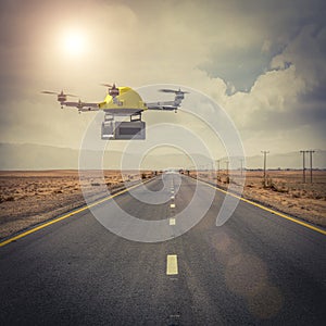 Drone for expeditions flies over an isolated road in the middle of the desert