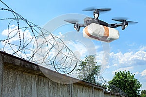 The drone flew across the sky with smuggling. The drone transports forbidden goods across the border breaking the law. Delivery of