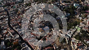 Drone Flies Above Guanajuato City Center in Mexico during Daytime: Catholic Church, University Buildings