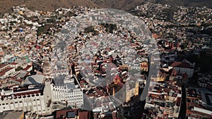 Drone Flies Above Guanajuato City Center in Mexico during Daytime: Catholic Church, University Buildings
