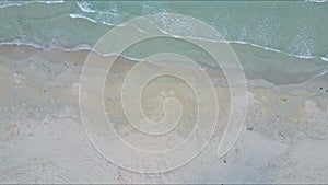Drone Flies over Sea Waves Surf Rolling on Sand Beach