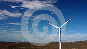 Drone Flies Over a Windmill Park . Aerial View of a Farm With Wind Turbines . Wind Power Turbines Generating Clean