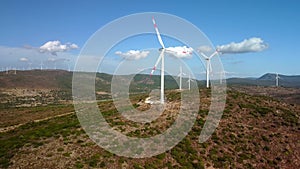 Drone Flies Over a Windmill Park . Aerial View of a Farm With Wind Turbines . Wind Power Turbines Generating Clean