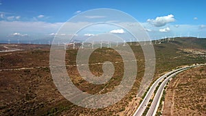 Drone Flies Over a Windmill Park . Aerial View of a Farm With Wind Turbines . Wind Power Turbines Generating Clean