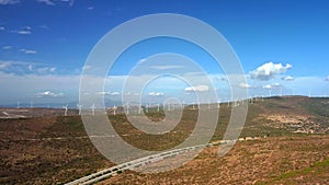 Drone Flies Over a Windmill Park . Aerial View of a Farm With Wind Turbines . Wind Power Turbines Generating Clean