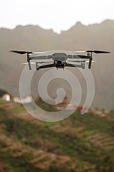 Drone flies and taking photos and videos in the mountains.