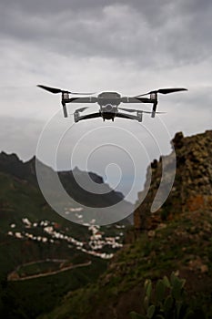 Drone flies and taking photos and videos in the mountains.