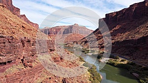Drone Flies Up In Canyon Colorado River With Red Massive Of Rocks