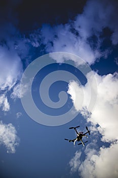 Drone in flight with cloudy sky