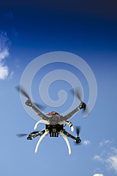Drone in flight with cloudy sky