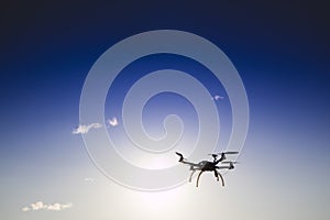 Drone in flight with cloudy sky