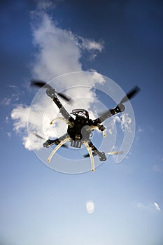 Drone in flight with cloudy sky