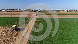 Drone Flight over Agricultural Fields and Wheat Fields being Harvested