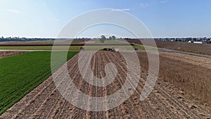 Drone Flight over Agricultural Fields and Wheat Fields being Harvested