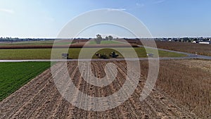 Drone Flight over Agricultural Fields and Wheat Fields being Harvested by Amish Farmer