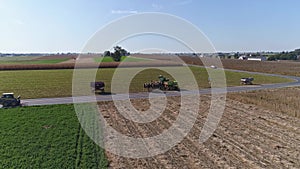 Drone Flight over Agricultural Fields and Wheat Fields being Harvested by Amish Farmer