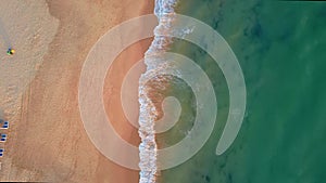 Drone flight over empty Gale beach in Portugal with top view on shoreline