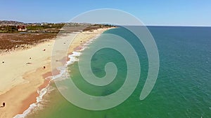 Drone flight over empty Gale beach in Portugal with top view on shoreline