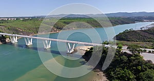 Drone flight over the freeway bridge over the Rio Mira near the town of Bairro Monte Vistoso