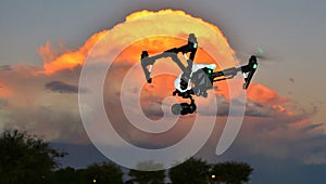 DRONE In Flight - Professional Camera (UAV / UAS) at Sunset