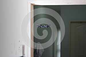 drone fly in the air inside resident through door playing with motion blur throtles or copter