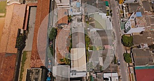 Drone flying above the coast line of Colombo, Sri Lanka. Aerial view of ocean, railroad, street traffic and buildings.