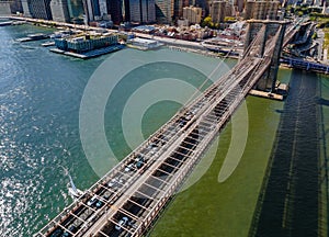 Drone flying close to over the Brooklyn bridge in Manhattan New York City USA during summer time