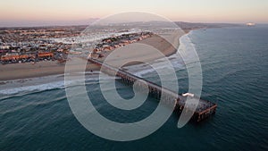 Drone flying high over Newport Beach ocean pier