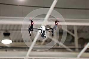 Drone flying in an industrial factory indoor