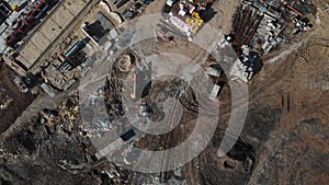 Drone flying over a construction site with a top down view. The camera flies superstructure, top-down view. Aerial view