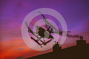 Drone flying over a sunset sky with light clouds Heavy lift quadrocopter fly photographing city