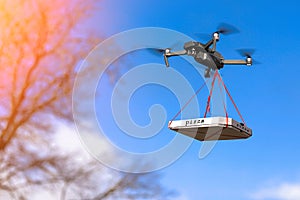 DRONE IS FLYING WITH A PIZZA