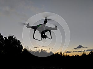 Drone flying at sunrise