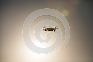 Drone flying at sunrise