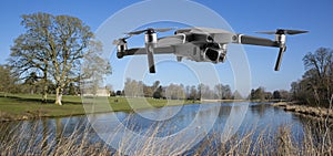 Drone flys by the lake at Lydiard House, Lydiard Park  Swindon, Wiltshire