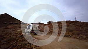 Drone footage of a 4x4 safari car ride across the desert Namib in Namibia