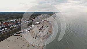 Drone footage of a crowded beach along the coast of Zandoort, Netherlands.