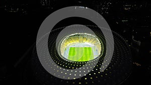 Drone footage of FC Dynamo Kyiv Stadium lighted at night. AERIAL view of Olympic Football stadium at night in Kiev