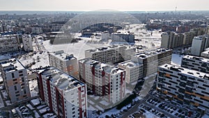 Drone footage of multistory apartment block urban sprawl during winter day